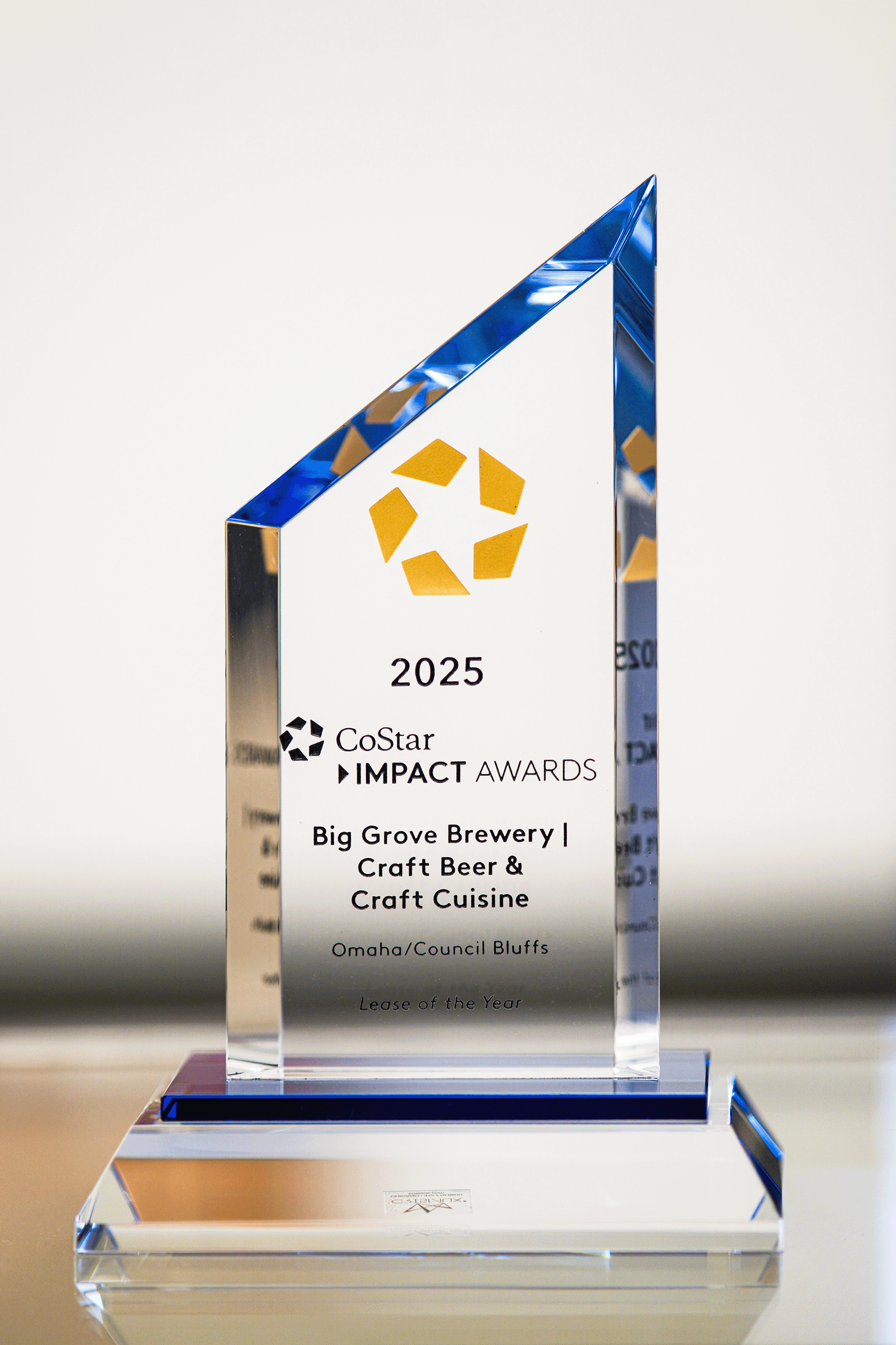 Glass plaque of 2025 CoStar Impact Award Winner